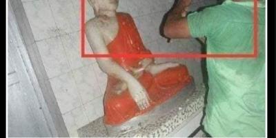 damaged Buddha statues
